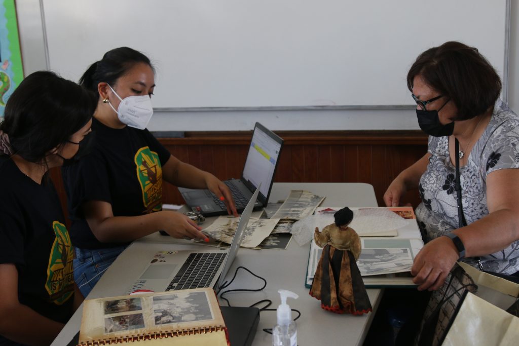 People going through archival materials