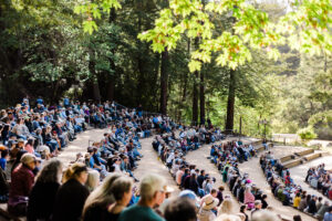people sitting in an amphitheater